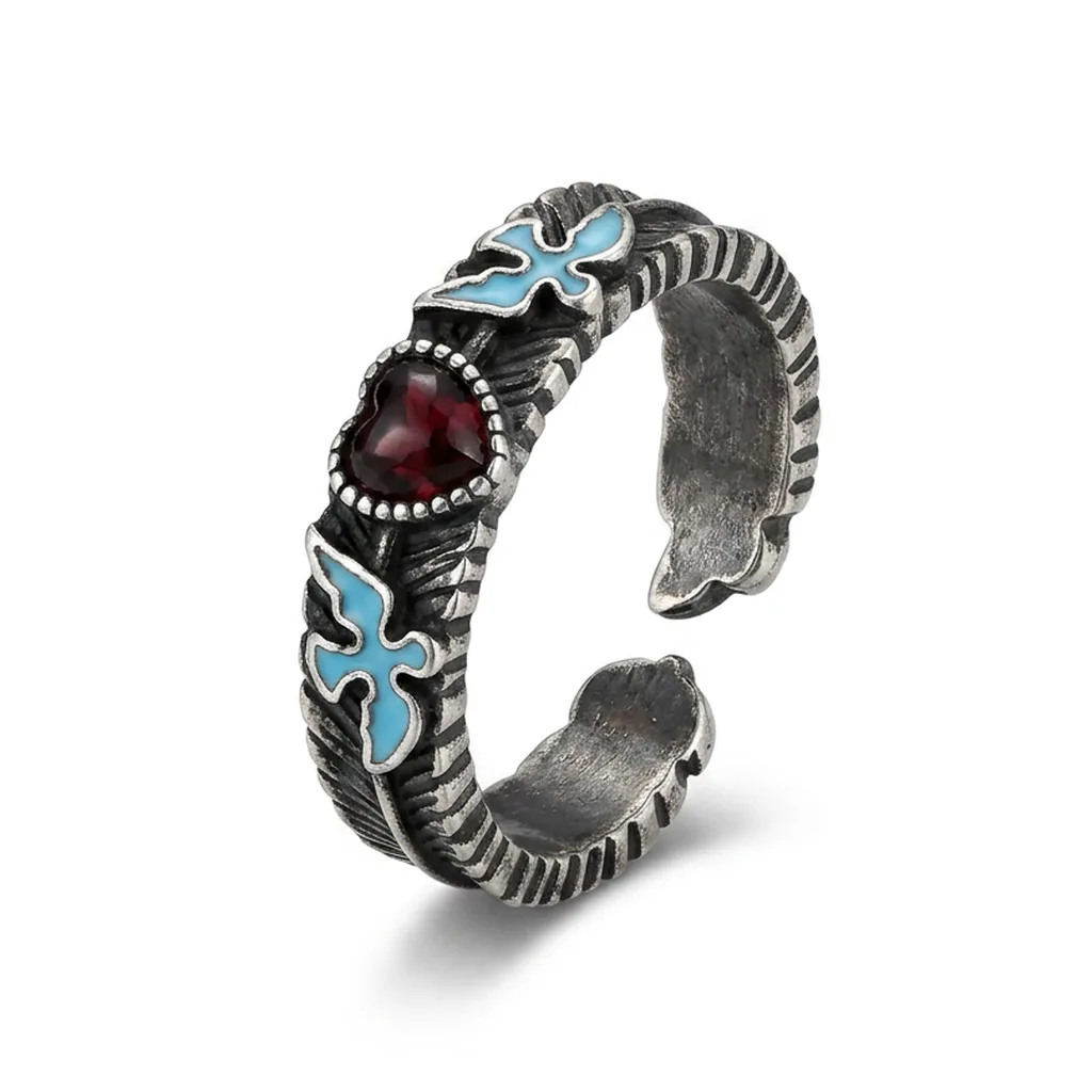 The same enamel ring on pure white after Foca AI — oxidised silver detail, turquoise enamel and the garnet all true to life