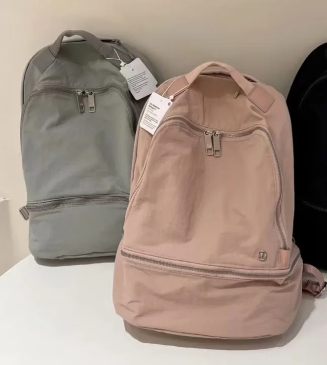 Lululemon backpack held up against a plain background, shot on a phone